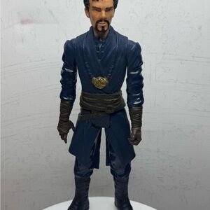 Action Figure with Blue Outfit and Gold Emblem